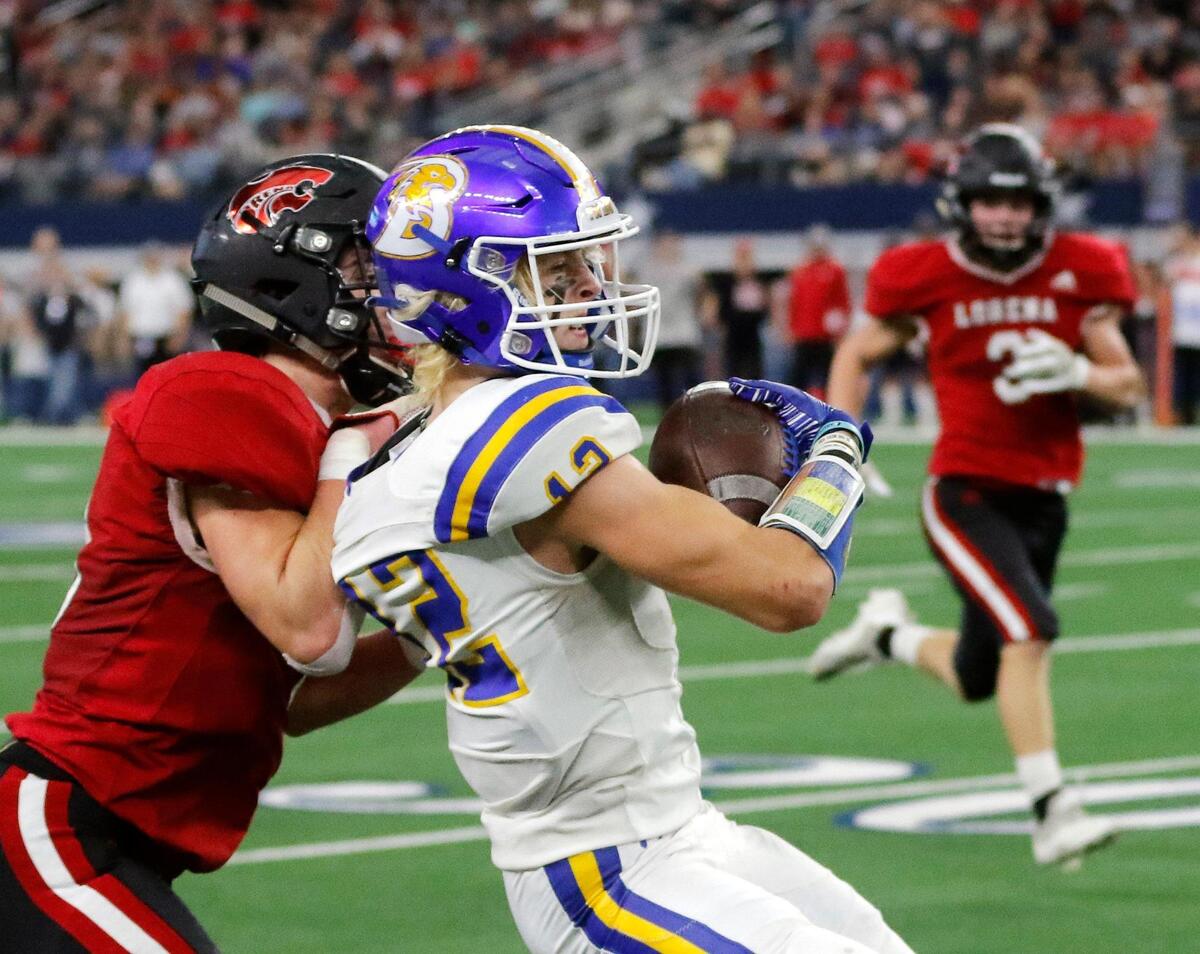 Brock wide receiver Elijiah Potts (12) grabs a pass along the side lines during a high school 3A division 1 state championship football game at AT&T Stadium in Arlington, Texas, Thursday, Dec. 16, 2021. Lorena led 14-6 at the half. (Special to the Star-Telegram Bob Booth)