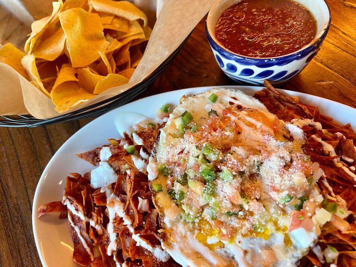 Chilaquiles rojos with an egg are served weekends at Paloma Verde in Mule Alley.