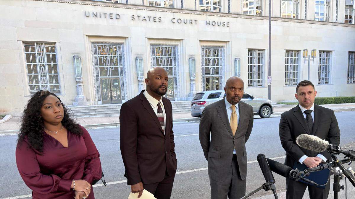 Former Sheriff’s Deputy Phillip Hill (right) stands next to attorney Daryl Washington and fellow former Sheriff’s Deputies Brandon Walker and Nyla Coleman across from the federal courthouse in downtown Fort Worth during a press conference on Oct. 16, 2024.