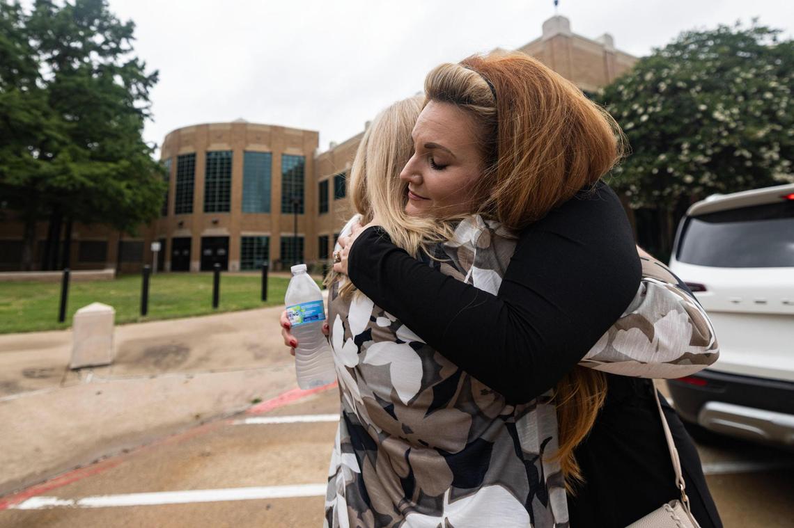 Kelly Chance, left, and Bridget Johns Scott, right, embrace after a news conference outside the Irving Police Department on Wednesday, June 11, 2025, announcing an arrest in the 1994 murder of Megan Johns. Chance was a high school friend of Megan Johns, and Scott is her younger half-sister. The two have spent the past 30 years advocating for the case to be solved.