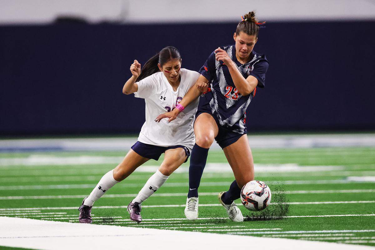 Grapevine forward Paola Granados (28) battles with a Frisco Wakeland defender for the ball in a Class 5A Division II UIL girls soccer state semifinal at the Ford Center on April 3, 2026 in Frisco, Texas.