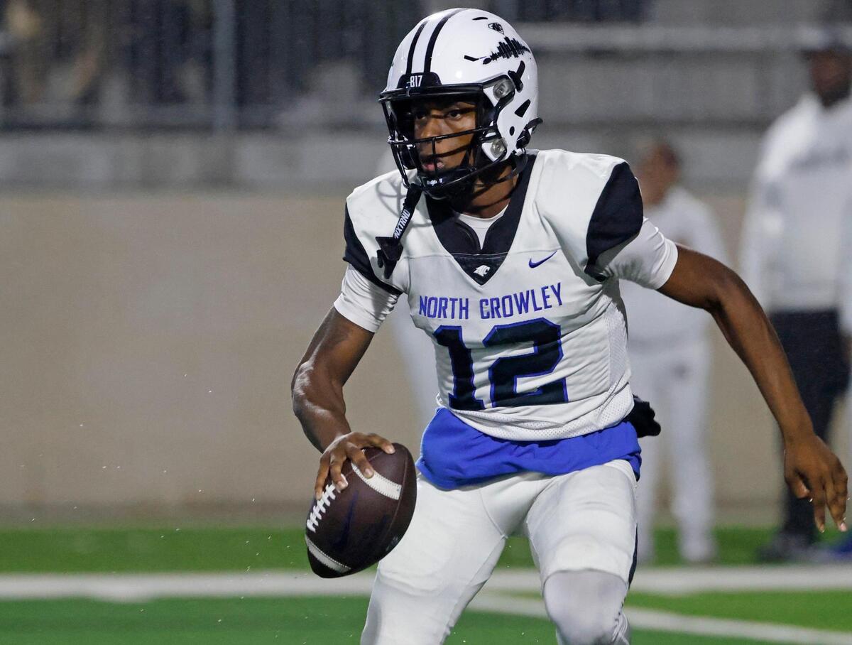 With all receivers covered North Crowley quarterback Chris Jimerson (12) scrambles out of the backfield during a UIL District 3-6A football game at Crowley ISD Multi-Purpose Stadium in Fort Worth, Texas, Thursday, Nov. 07, 2024.