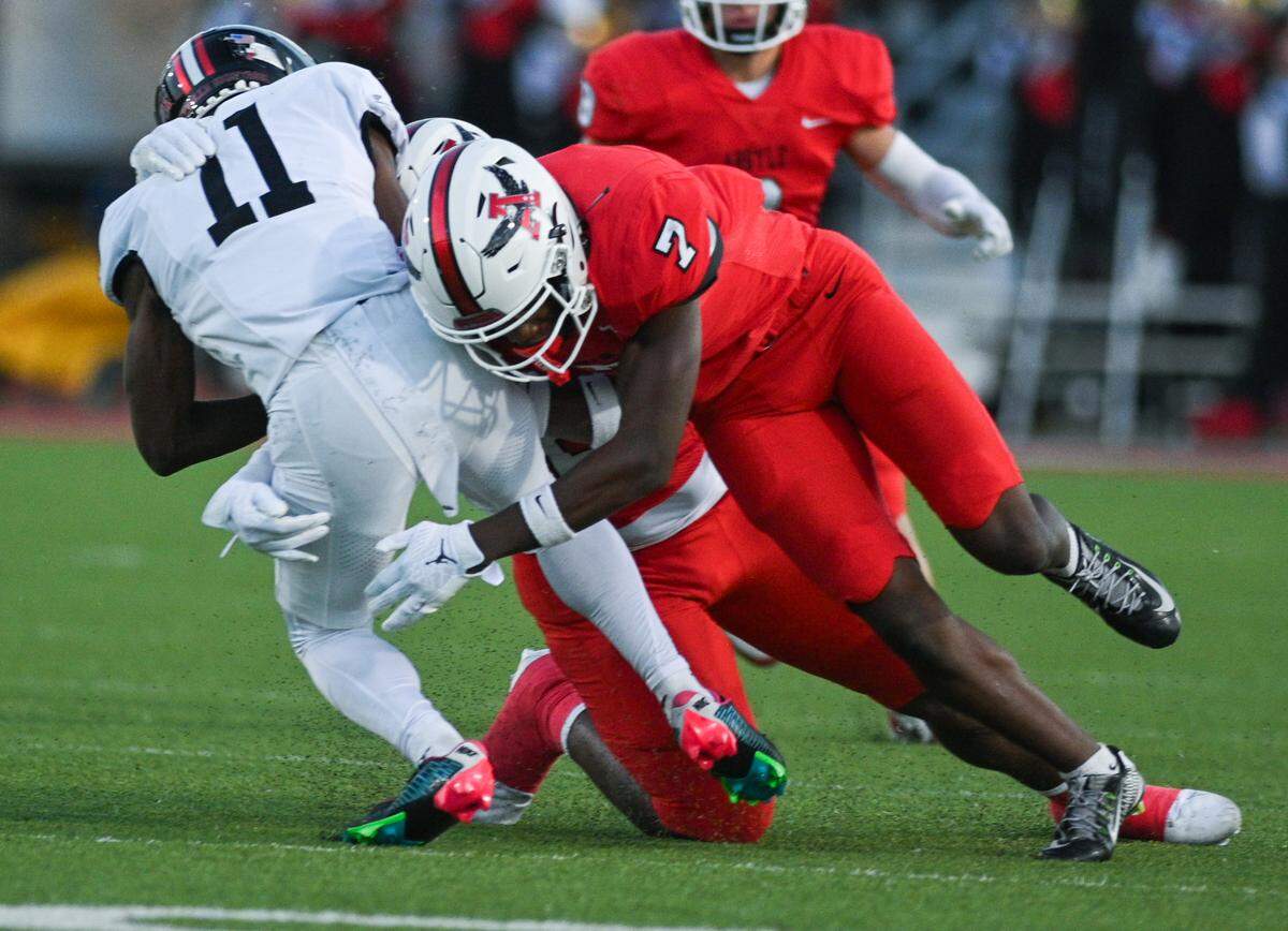 Argyle defensive back Maliek Bracy (7) tackles Colleyville Heritage running back Jerrod Wiley (11) during a UIL football game at Eagle Stadium in Argyle, Texas on Friday, Sept. 27, 2024.