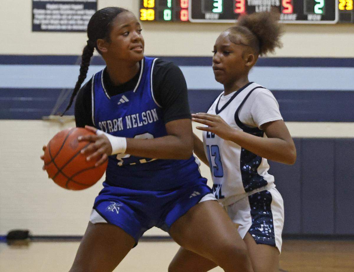 Byron Nelson forward Trinity Diggs (23) is defended by L.D. Bell guard Jenai Griffin (13) during the first half of a girls UIL basketball game between Byron Nelson and L.D. Bell at L.D. Bell High School in Hurst, Texas, Friday Feb. 06, 2026