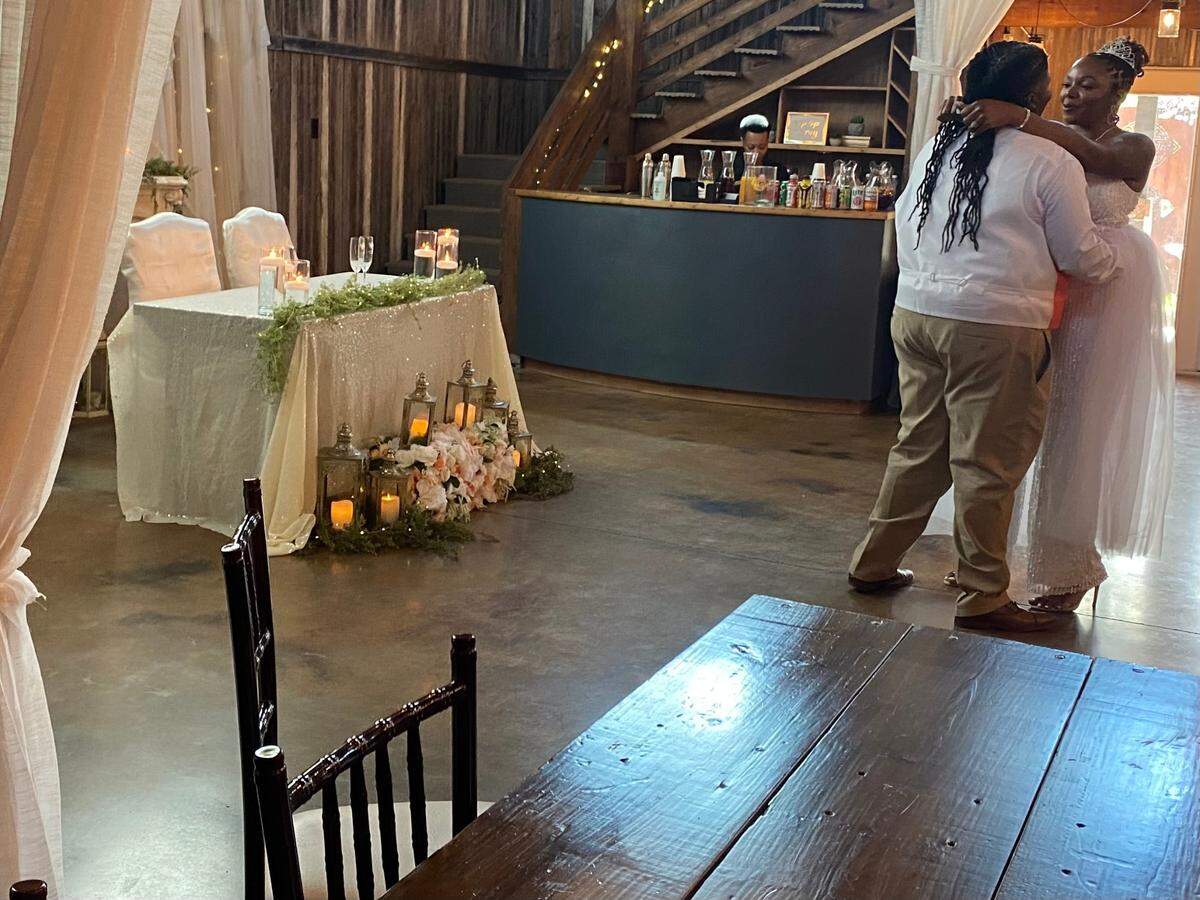 Quintisha and Tyechia McCree dance after they were married on Sunday, June 19, 2022, in Aledo.