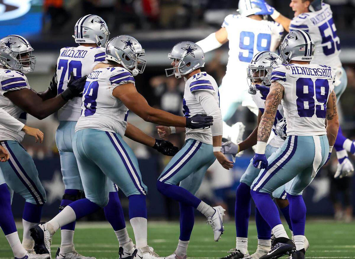 Teammates rush kicker Brett Maher after he kicked a field goal in the fourth quarter to win the game for the Dallas Cowboys on Sunday, September 18, 2022.