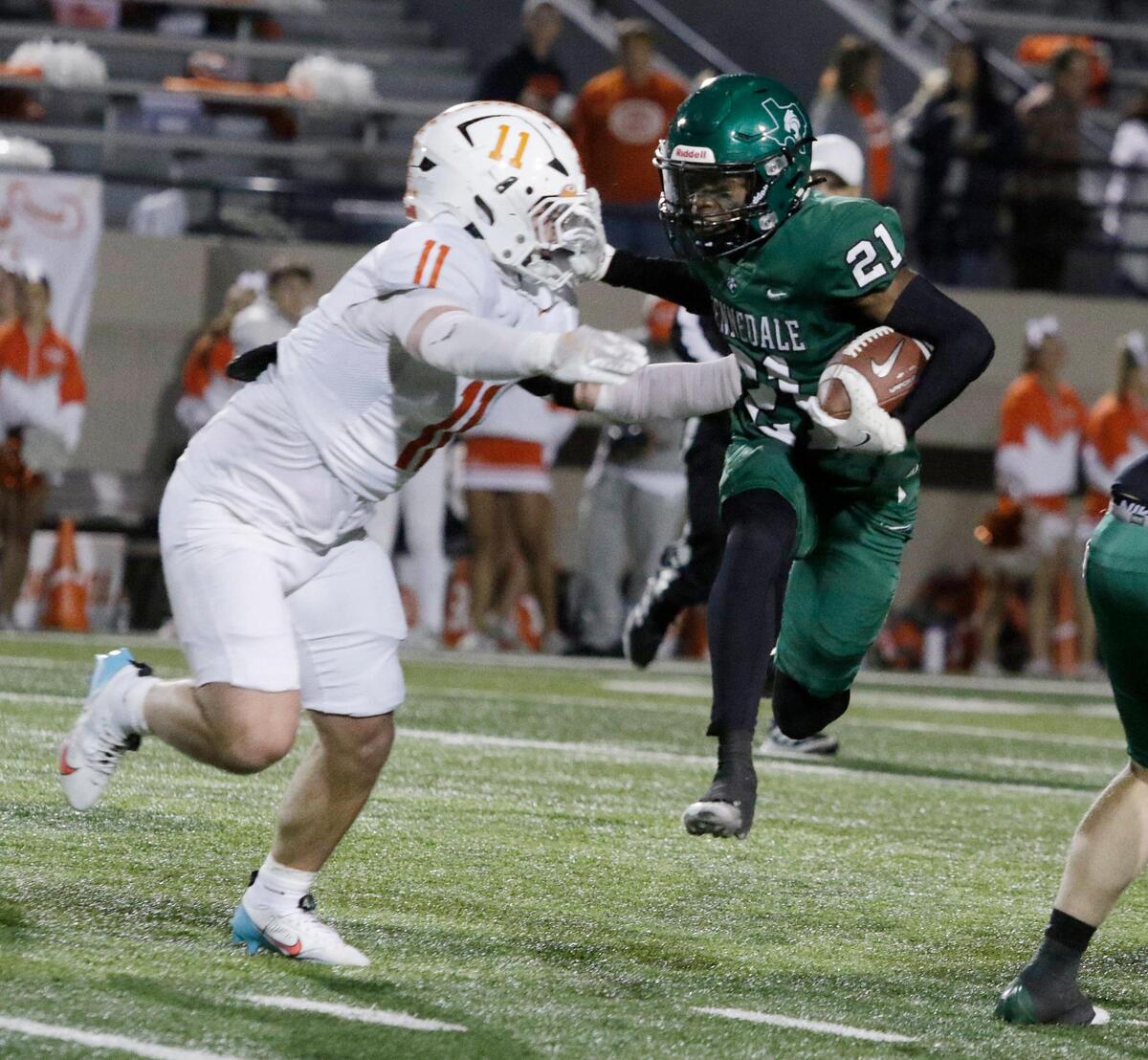 Kennedale’s Josh Cornwell tires to escape the tackle of Celina’s Luke Biagini during a UIL football playoff game at Pennington Field on Friday November 22, 2024.