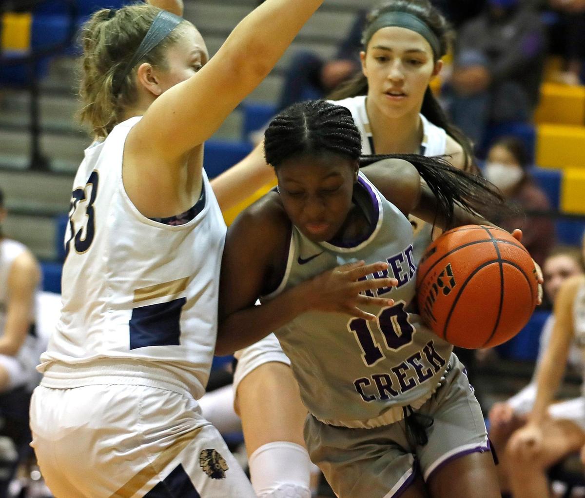 Timber Creek guard Mackenzee Jones (10) turns the corner against Keller forward Kimber Grant (33) in the first half of a 4-6A district high school girls basketball game at Keller High School in Keller, Texas, Thursday, Jan. 28, 2021. Timber Creek led 28-27 at the half. (Special to the Star-Telegram Bob Booth)
