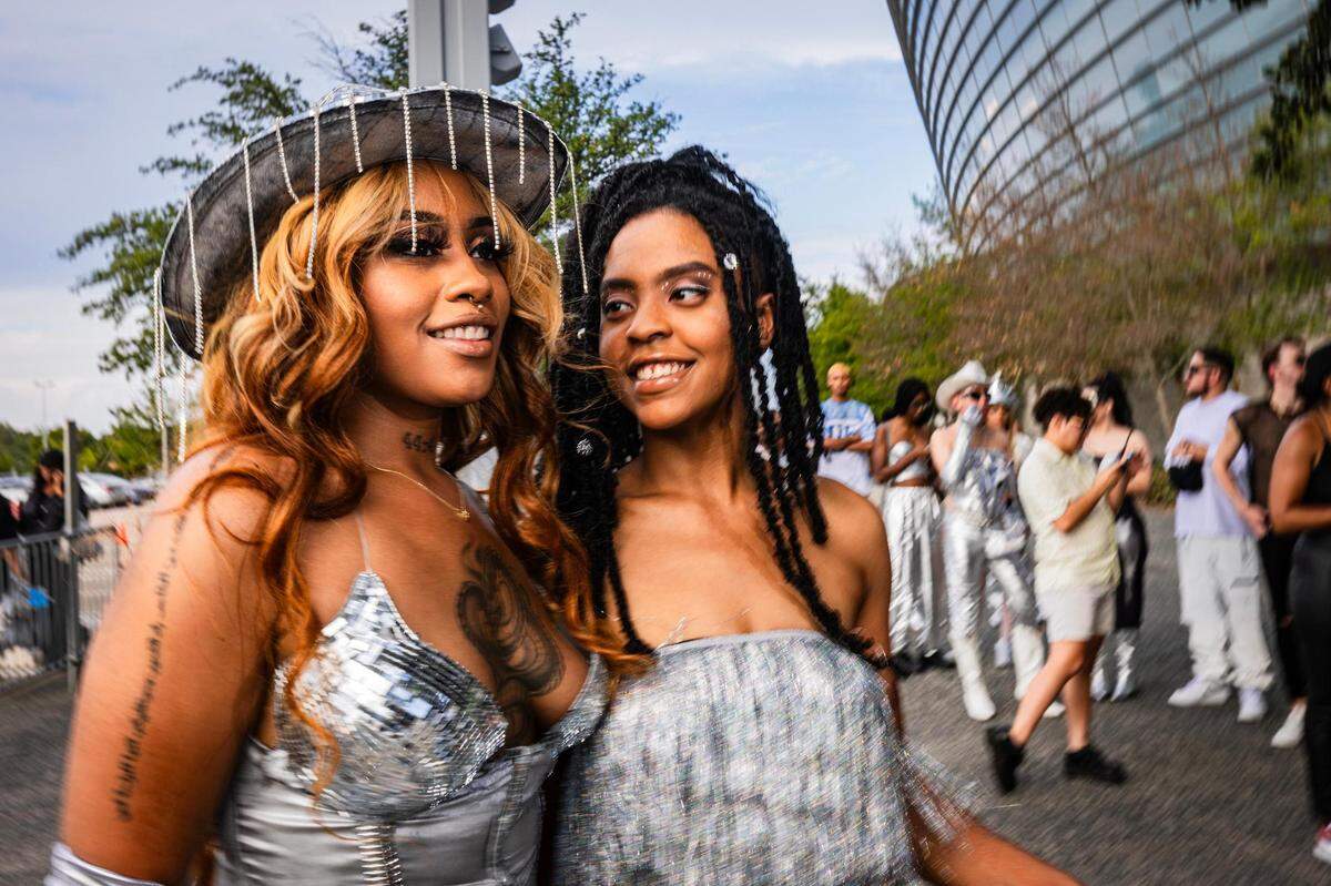 Anissa Revelo, left, and Jada Cooperwood pose for a portrait with her facial accessories before entering Beyonce’s Renaissance World Tour at AT&T Stadium in Arlington on Thursday, Sept. 21, 2023.