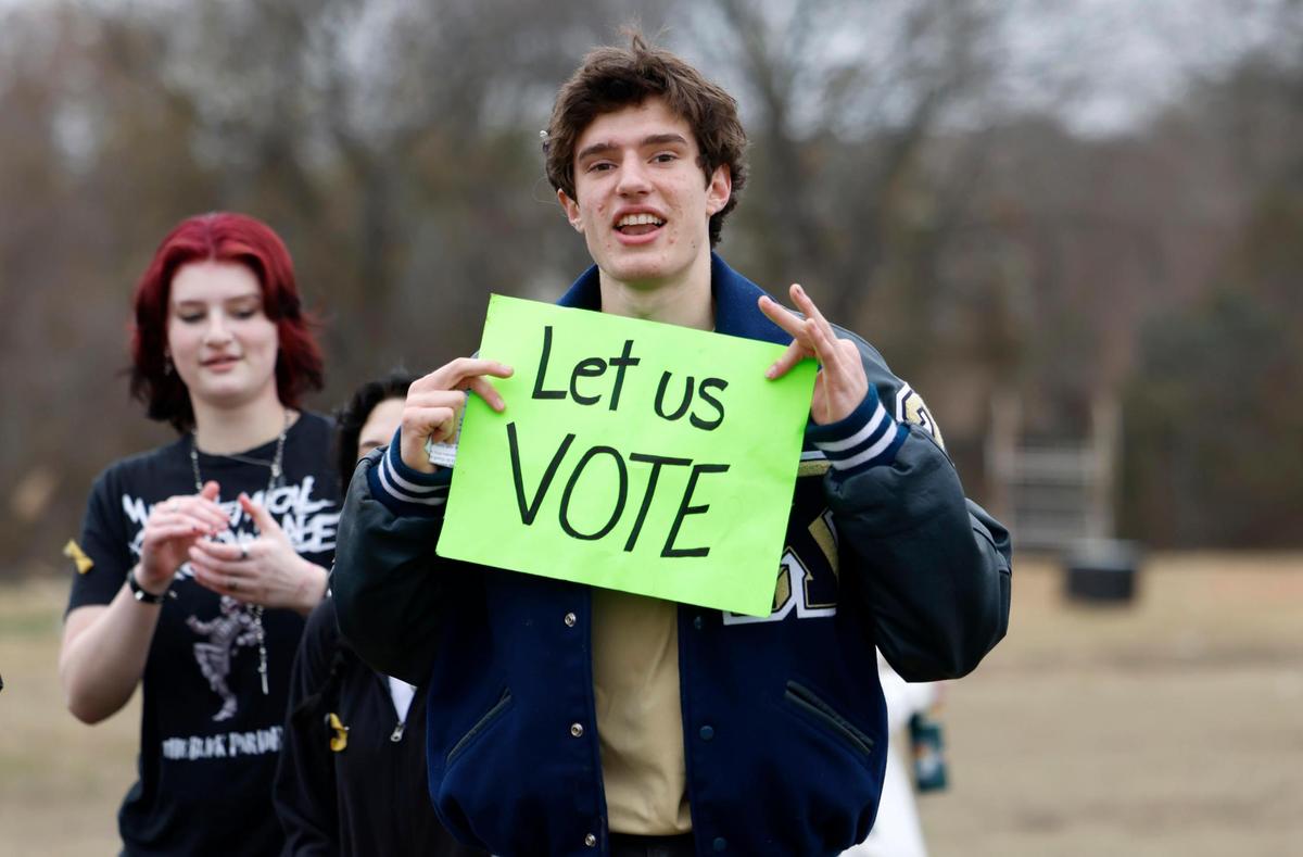 Keller High sophomore Heath Shiflett walks out with fellow Keller ISD students on Friday, Feb. 7, 2025, to protest the proposed split of the school district.