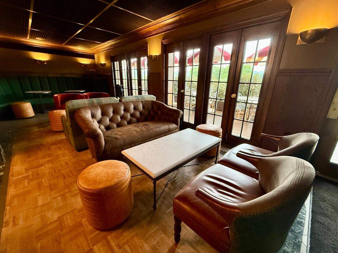 A cozy, clubby bar and indoor dining at Stewart’s Croquet & Cocktail Club, seen May 17, 2025.