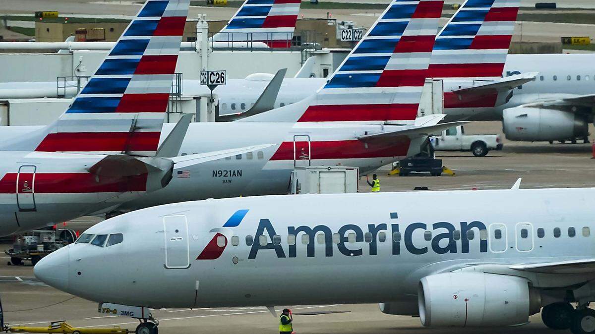 An American Airlines plane pushes back from the gate at Dallas Fort Worth International Airport. (Smiley N. Pool/The Dallas Morning News/TNS)