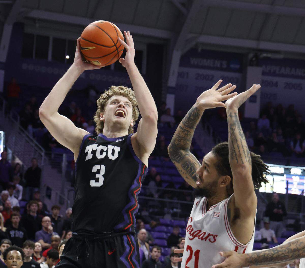 TCU guard Liutauras Lelevicius (3) gets a shot over Houston guard Emanuel Sharp (21) during the second half of a NCAA basketball game between the University of Houston and TCU at Schollmaier Arena in Fort Worth, Texas, Wednesday Jan. 26, 2026