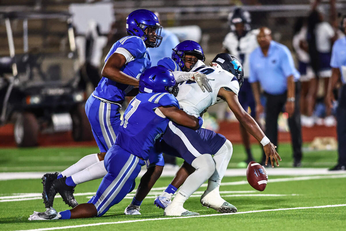 Wyatt quarterback Jorvorskie Lane, Jr. gets sacked by three Dunbar defenders on Thursday, September 5, 2024 at Clark Stadium in Fort Worth, Texas. Dunbar rallied to defeat Wyatt 14-13.