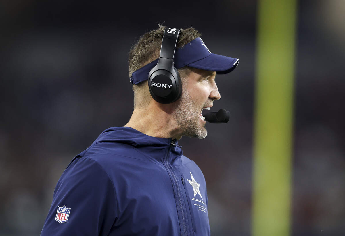 Dallas Cowboys head coach Brian Schottenheimer calls out on a play from the sidelines during the first half of the game Thursday, Oct. 8, 2026, at AT&T Stadium in Arlington.