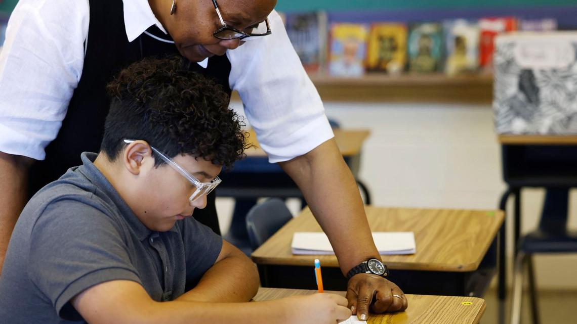 English teacher Jeannette Jones-Wilson helps sixth grader Francisco Garcia during class on Tuesday, Sept. 10, 2024, at Wedgwood Middle School in Fort Worth. TCU’s College of Education is collaborating with the Fort Worth ISD to place its graduates in district teaching residencies.
