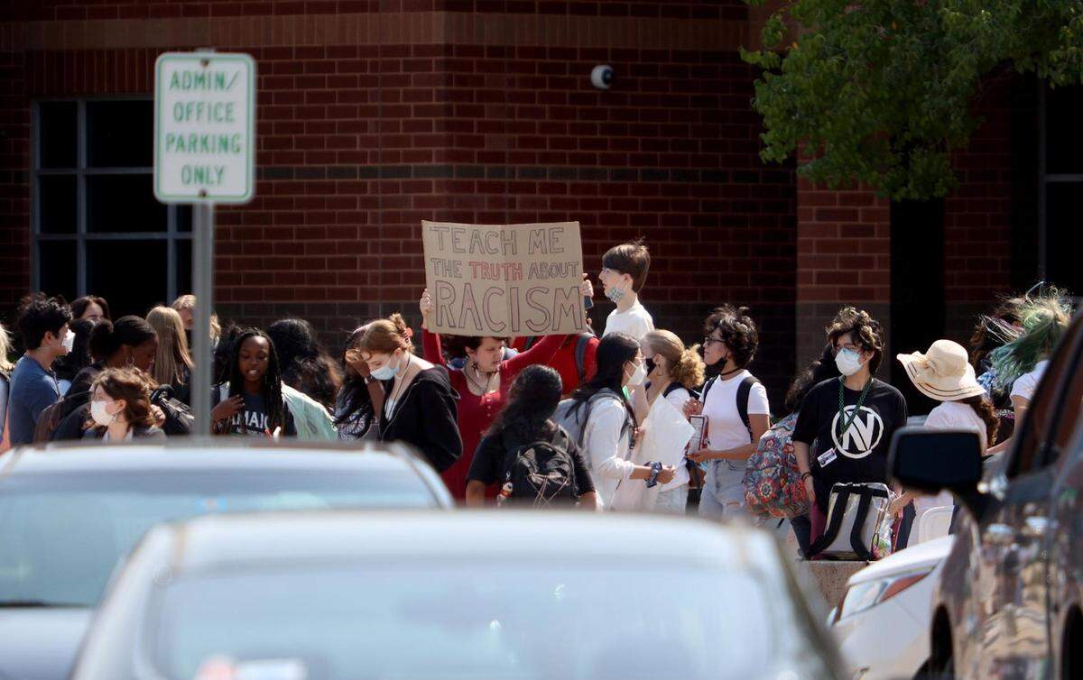 In this September 2021 file photo, students at Colleyville Heritage High School protest the placing of principal James Whitfield on paid administrative leave by walking out of class.