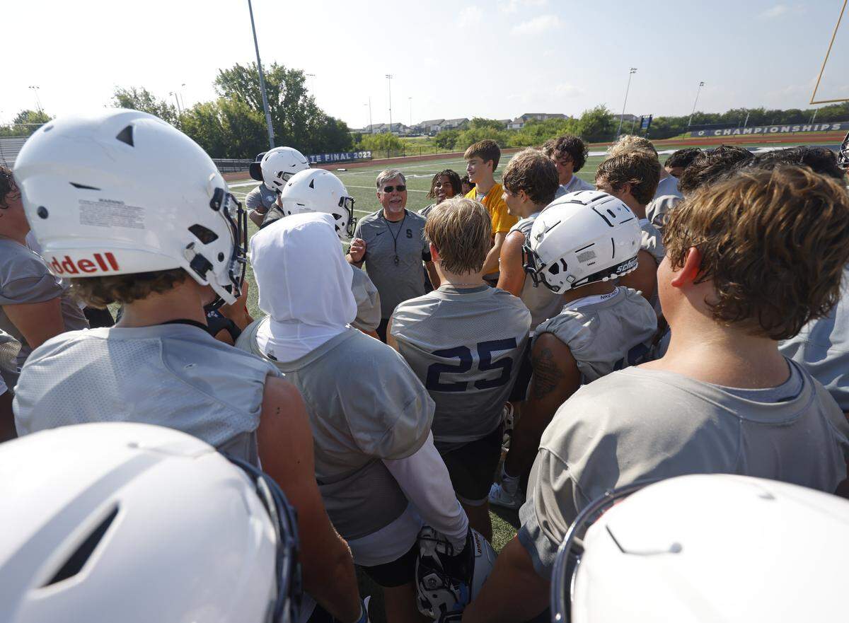 Head coach Aaron Beck talks with players after the first practice of 2025 for the All Saints in Fort Worth, Texas, Tuesday August, 05, 2025.