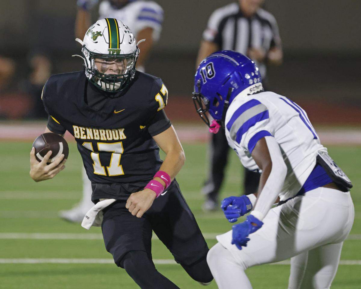 Benbrook quarterback Brennan Barton (17) avoids the tackle of Dunbar defensive back Bryce Allen (10) during the first half of a UIL football game between Benbrook and Dunbar at Herman E. Clark Stadium in Fort Worth, Texas, Friday, October 10, 2025.