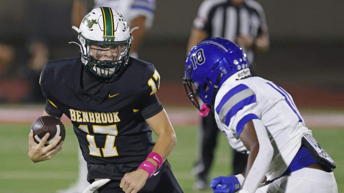Benbrook quarterback Brennan Barton (17) avoids the tackle of Dunbar defensive back Bryce Allen (10) during the first half of a UIL football game between Benbrook and Dunbar, Friday, Oct. 10, 2025, at Herman E. Clark Stadium in Fort Worth.