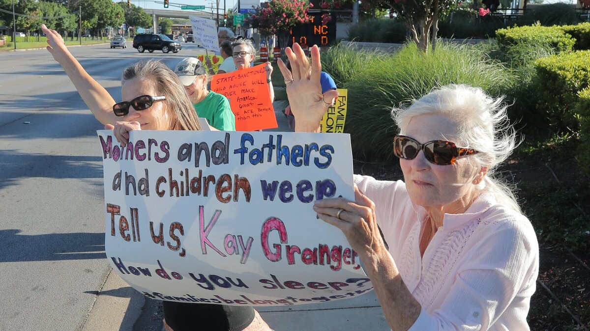 Caryl Sherman Gonzalez and Carol Savage Jones protest on University Drive near U.S. Rep. Kay Granger's office to oppose the policy of separating children from parents who are being detained for entering the country on the border, Friday, June 15, 2018.