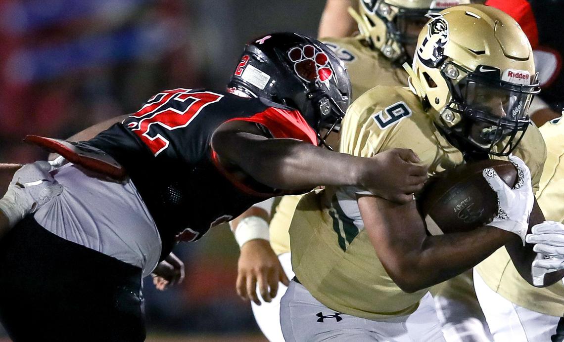 Birdville running back Laderrious Mixon (9) tries to break tackle from Colleyville Heritage linebacker Leo Covington (22) during the first haif, Friday night, November 1 2019 played at Mustang Panther Stadium in Grapevine, TX.
