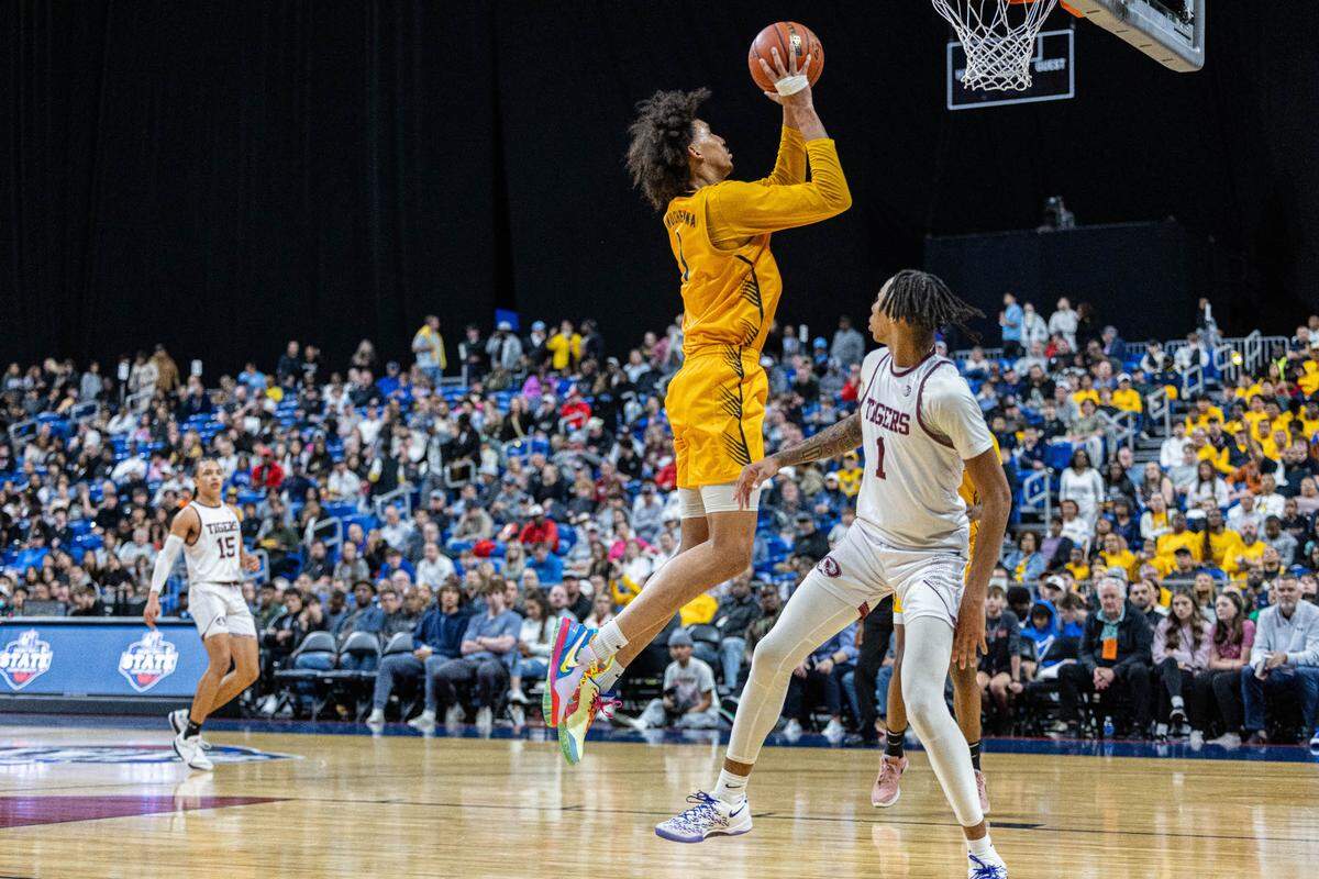 Oak Cliff Faith Family senior forward Doryan Onwuchekwa makes a layup in the Class 4A state championship game on Saturday, March 9, 2024 at the Alamodome in San Antonio, Texas. Faith Family defeated Silsbee 80-66.
