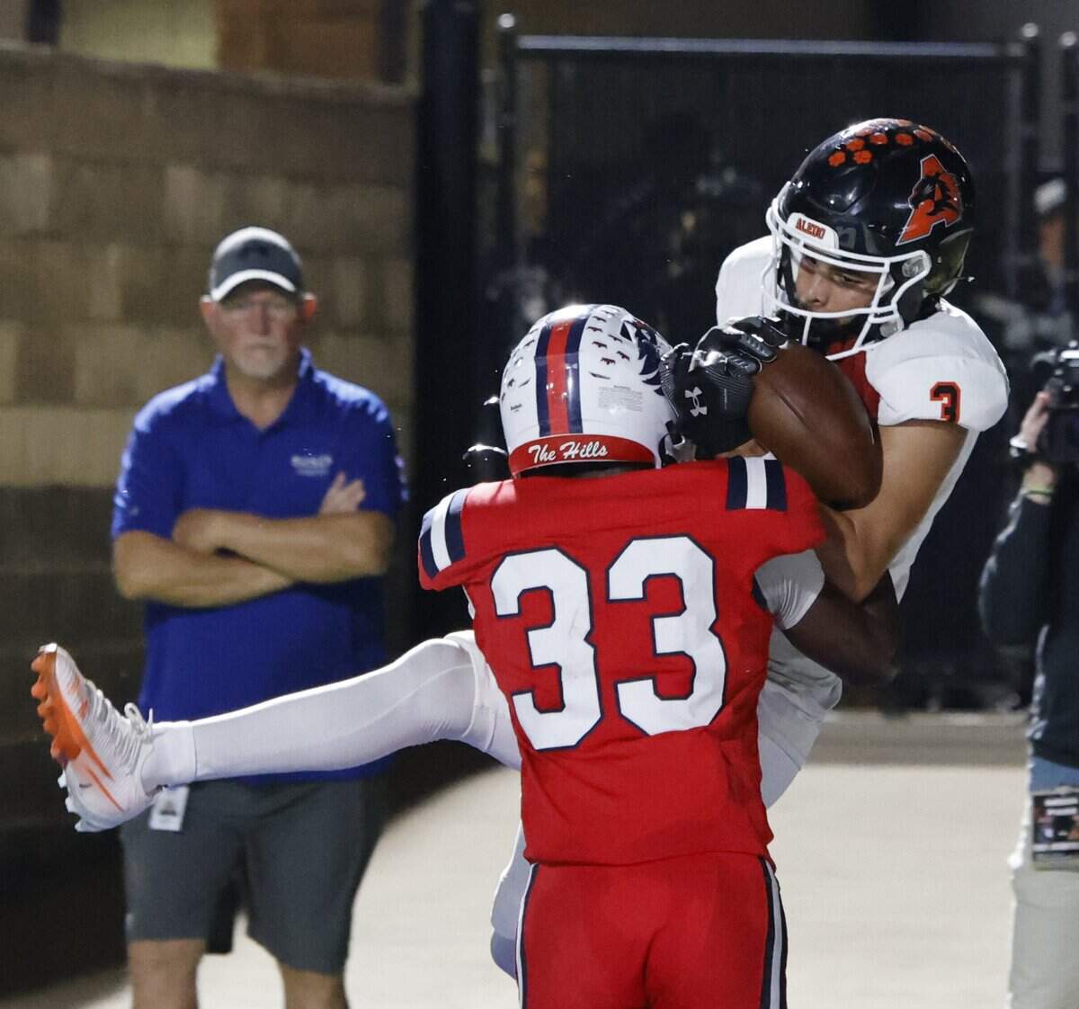 Aledo wide receiver Jamal Hollister (3) makes the catch in the end zone as North Richland Hills Richland defensive back Bryson Johnson (33) pushes him out of bounds during the first half of a UIL football game on Thursday, October, 23, 2025 at Birdville FAAC Stadium in North Richland Hills, Texas.