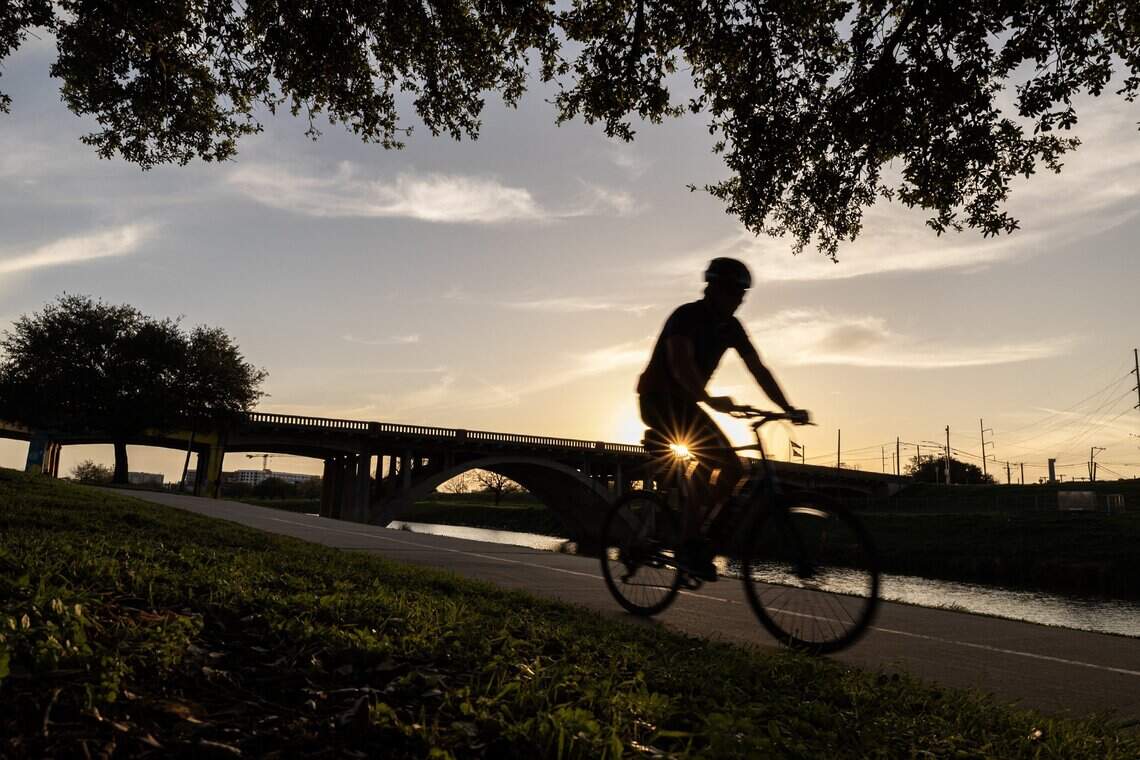 Cyclists riding on Discovery Trail near Panther Island Pavilion in Fort Worth