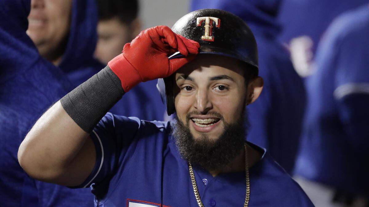 Rougned Odor had reason to smile late Tuesday. He delivered the go-ahead three-run double in the ninth inning as the Rangers won 9-5.