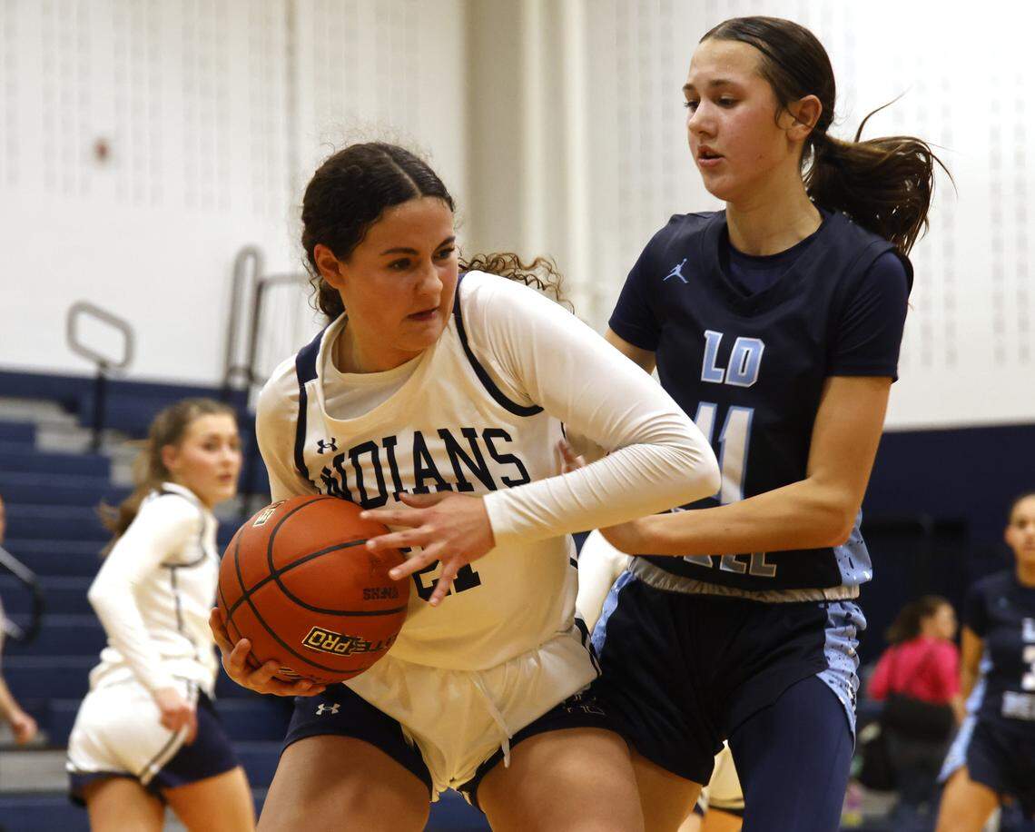 Keller shooting guard Audrey Heibel (21) backs into L.D. Bell guard Reagan Bennett (11) during the first half of a UIL girls basketball game between L.D. Bell and Keller at Keller High School in Keller, Texas, Friday Jan. 16, 2026