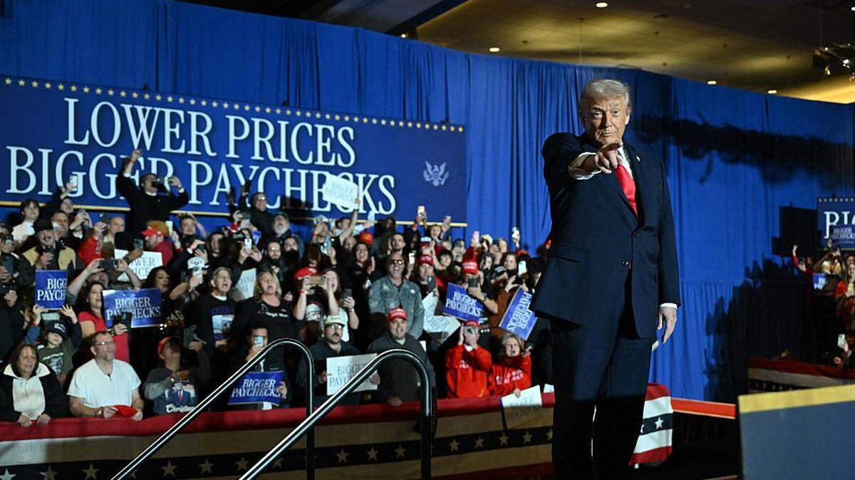 US President Donald Trump cheers attendees upon his arrival to deliver remarks on the economy at Mount Airy Casino Resort in Mount Pocono, Pennsylvania, on December 9, 2025. (Photo by ANDREW CABALLERO-REYNOLDS / AFP via Getty Images)