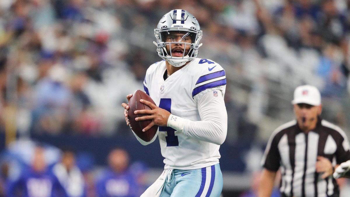 Dallas Cowboys quarterback Dak Prescott looks for an open receiver in the first quarter while playing the New York Giants Sunday, October 10, 2021, at AT&T Stadium.