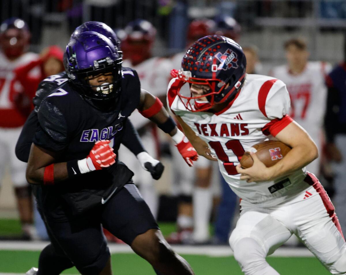 Northwest quarterback Ryder Norton (11) attempts to avoid the tackle of Crowley defensive end Keshawn Morris (7) during a UIL Class 6A D2 Bi-district playoff football game at Crowley ISD Multi-Purpose Stadium in Fort Worth, Texas, Friday, Nov. 15, 2024.