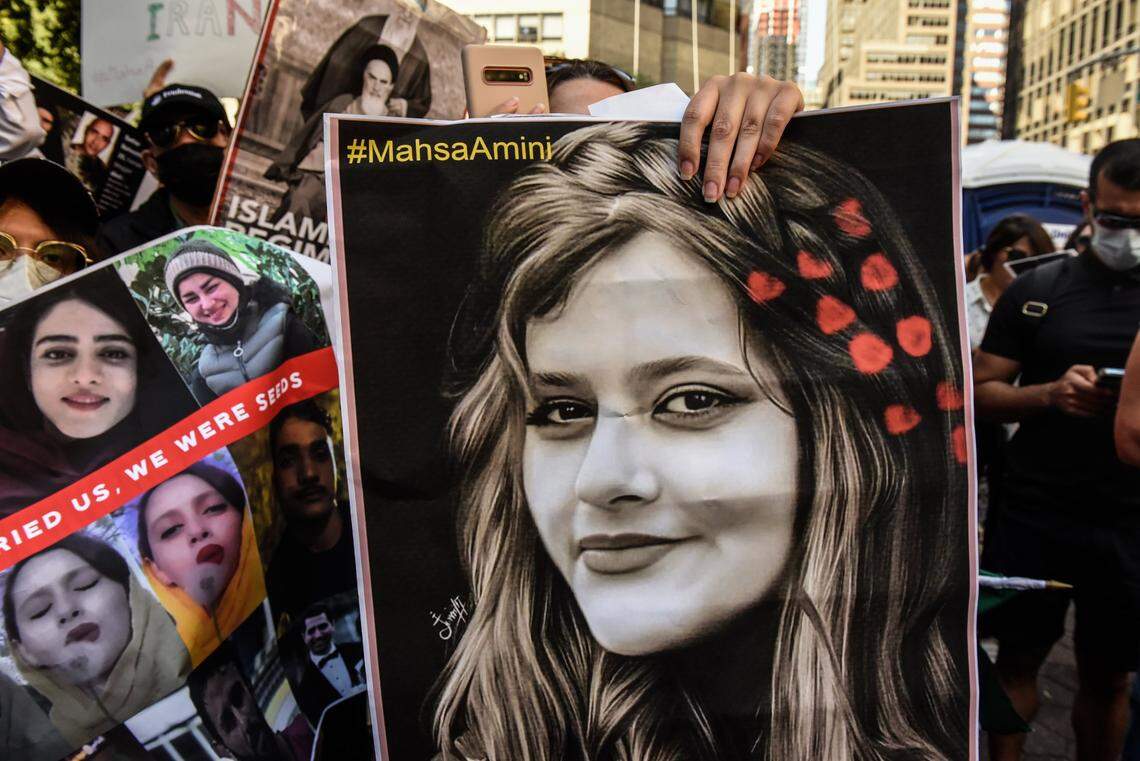 People participate in a protest against Iranian President Ebrahim Raisi outside of the United Nations on Thursday, Sept. 21, 2022, in New York. Protests have broke out over the death of a 22-year-old Iranian woman, Mahsa Amini, who died in police custody for allegedly violating the country’s hijab rules. (Stephanie Keith/Getty Images/TNS)