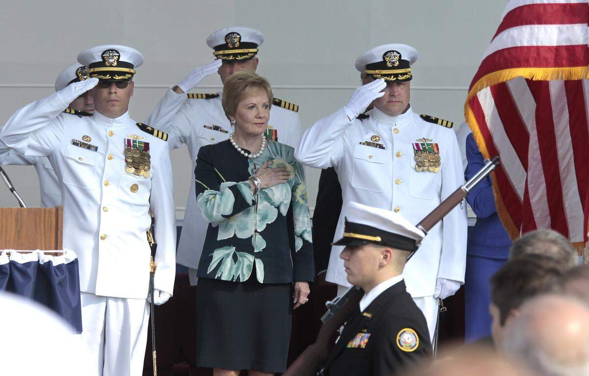 Rep. Kay Granger stands at attention with CmrdS. Randy Blankenship, left, and Warren Cupps for the opening of the commissioning ceremony for the USS Fort Worth in Galveston on Sept. 22, 2012.