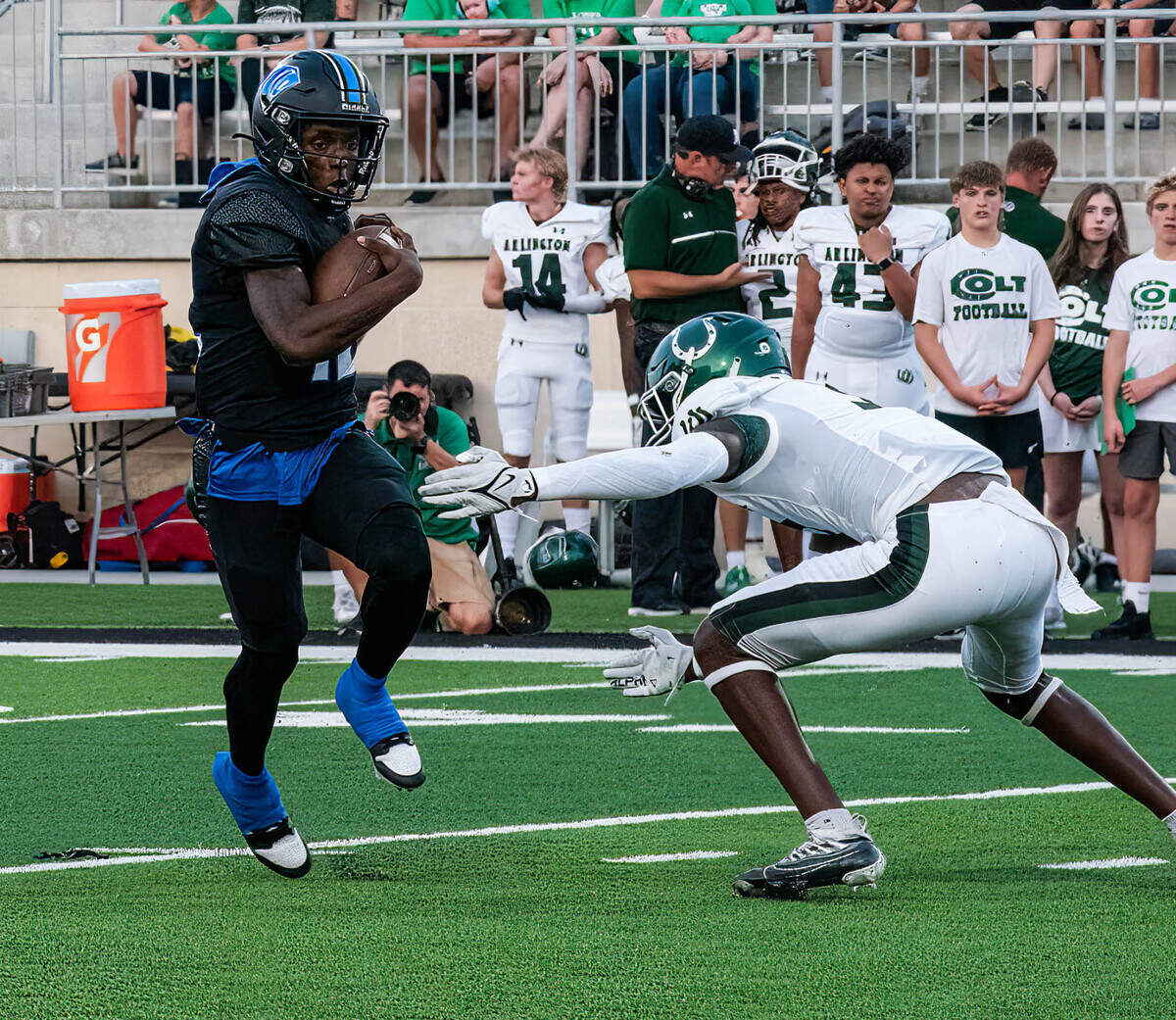 North Crowley quarterback Chris Jimerson Jr. eludes an Arlington High defender on Friday September 1, 2023 at Crowley IDS Stadium in Fort Worth, Texas.