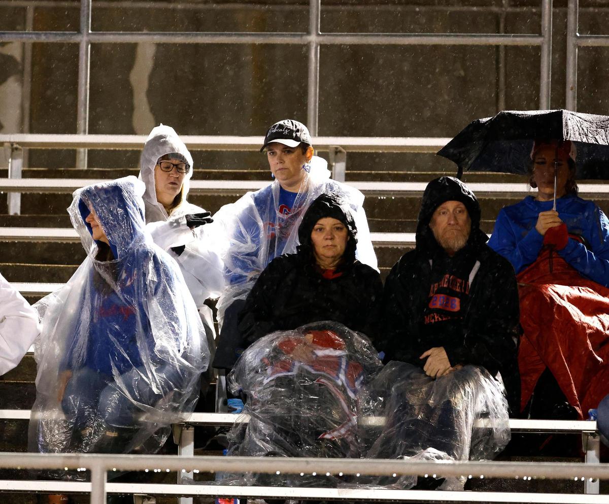 Grapevine fans weathered the rain the first half of a UIL 5A D2 football playoff game at Mustang Panther Stadium in Grapevine, Texas, Thursday, Nov. 09, 2023.
