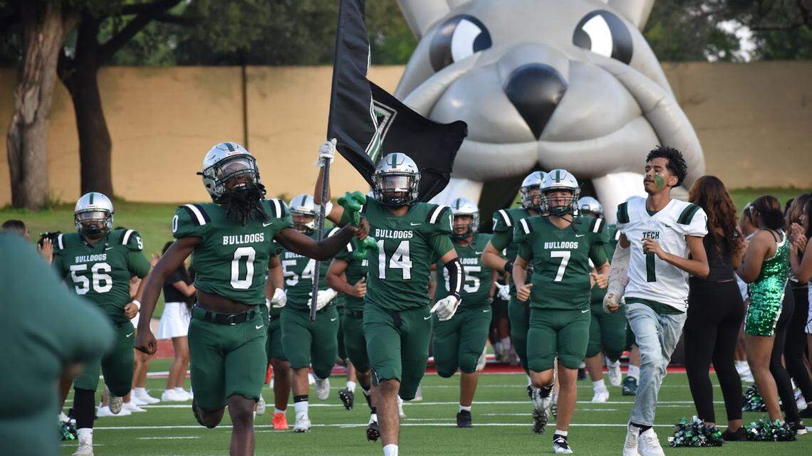 The Trimble Tech Bulldogs take the field during their homecoming football game against Dallas Samuell at Farrington Field in Fort Worth, Texas, Thursday, Sept. 8, 2022. Trimble Tech won 42-6. (Mateo Perez/Special to the Star-Telegram)