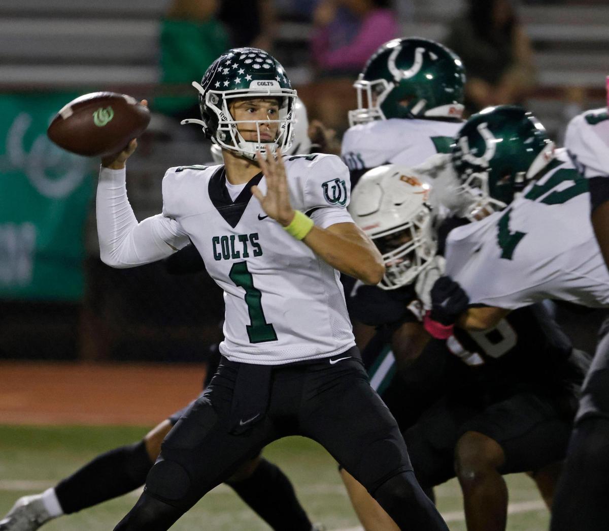 Arlington quarterback Coleman Cravens (1) unloads down field during a District 8-6A football game at C.H. Wilemon Field in Arlington, Texas, Friday, Oct. 18, 2024.