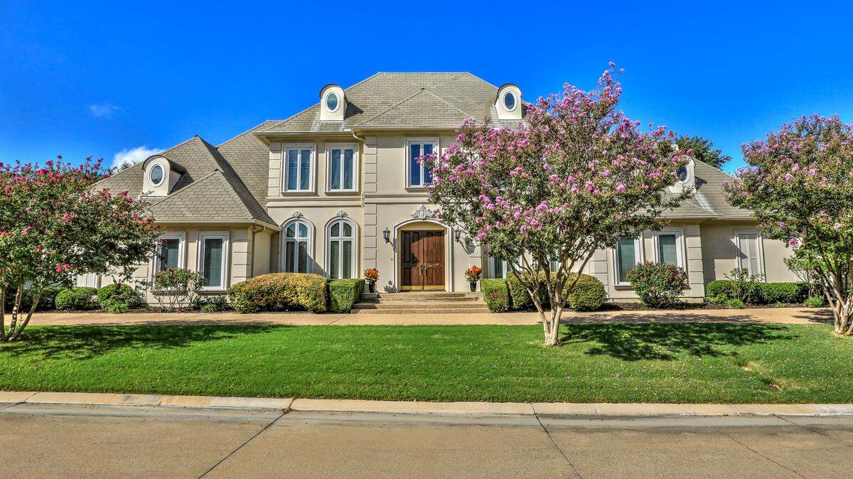 The home at 5792 Forest Highlands Drive was designed to take full advantage of the stellar golf course views. 

