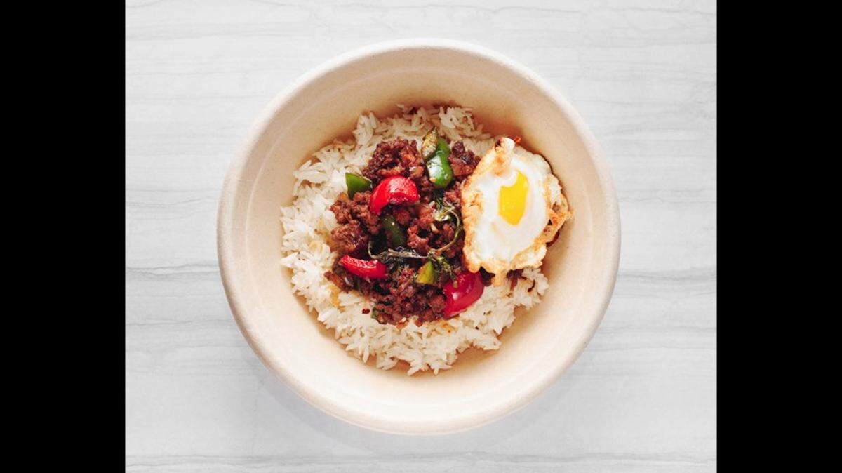 Kra pao (wok-seared ground pork, jasmine rice, basil, bell peppers, onions, mortar-smashed chilies, fried egg) from Dallas’ Crushcraft Thai Eats, one of the vendors at the NFL Draft Experience food court at AT&T Stadium