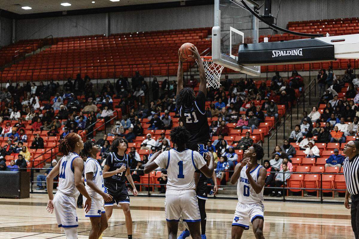 Eastern Hills boys basketball forward Dorian Johnson rises for a dunk against Fort Worth Dunbar on Thursday, Jan. 2, 2024.