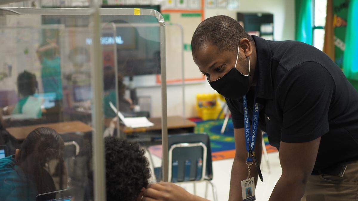 First-year teacher Ajaysie Gipson helps a student at Cesar Chavez Learning Center in the Dallas Independent School District. Gipson is a student of Urban Teachers DFW, a teacher prep school involved in the edTPA pilot program.