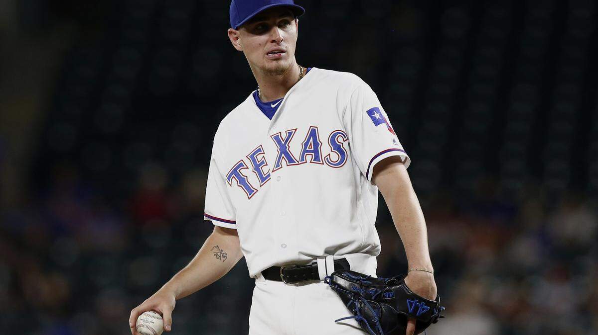 Things got so bad for the Rangers on Monday that they had to use outfielders Carlos Tocci, above, and Ryan Rua as pitchers. It was the first time in club history the Rangers used two position players on the mound in the same game.