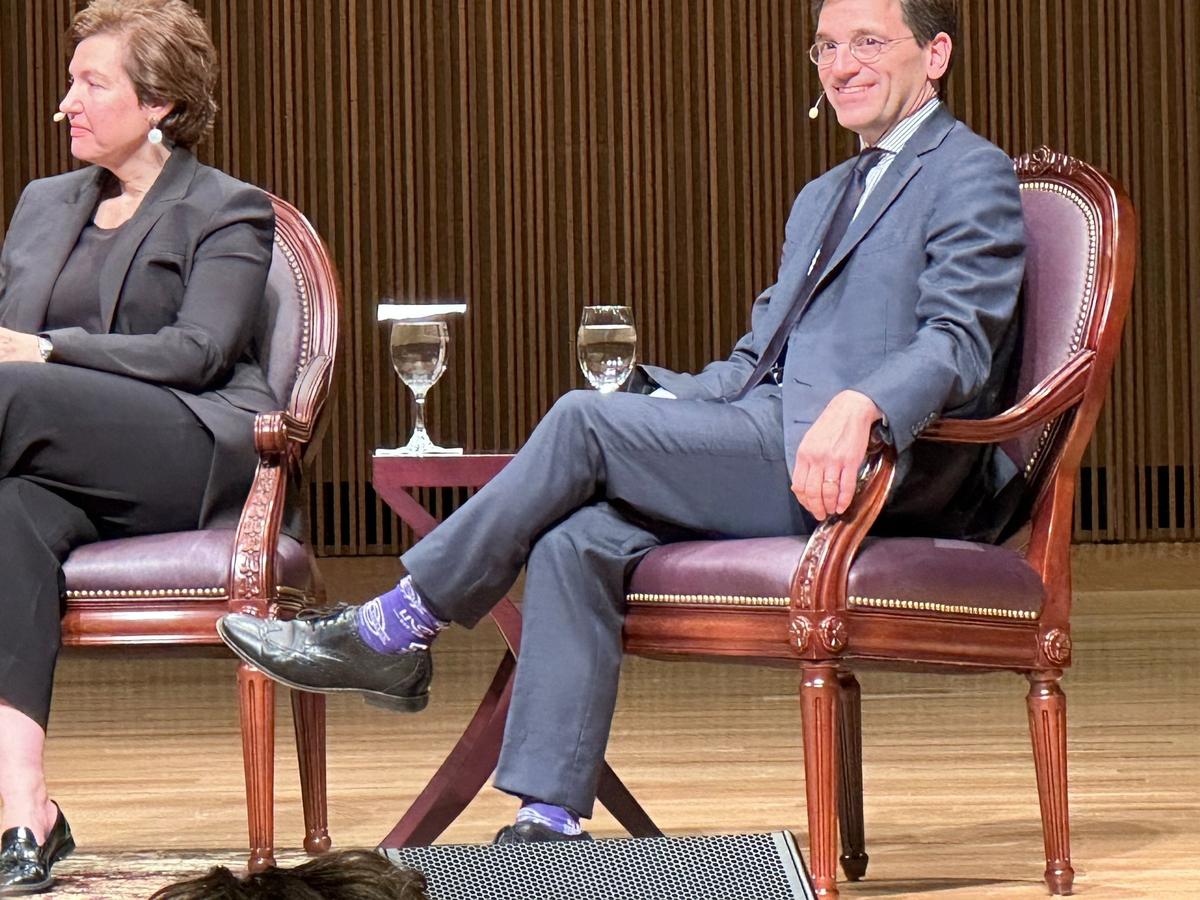 Peter Baker of The New York Times (right), appearing with Susan Glasser of The New Yorker, wore purple socks in honor of longtime CBS News reporter and anchor Bob Schieffer for the Schieffer Symposium on Tuesday, Nov. 8, 2023 at TCU.