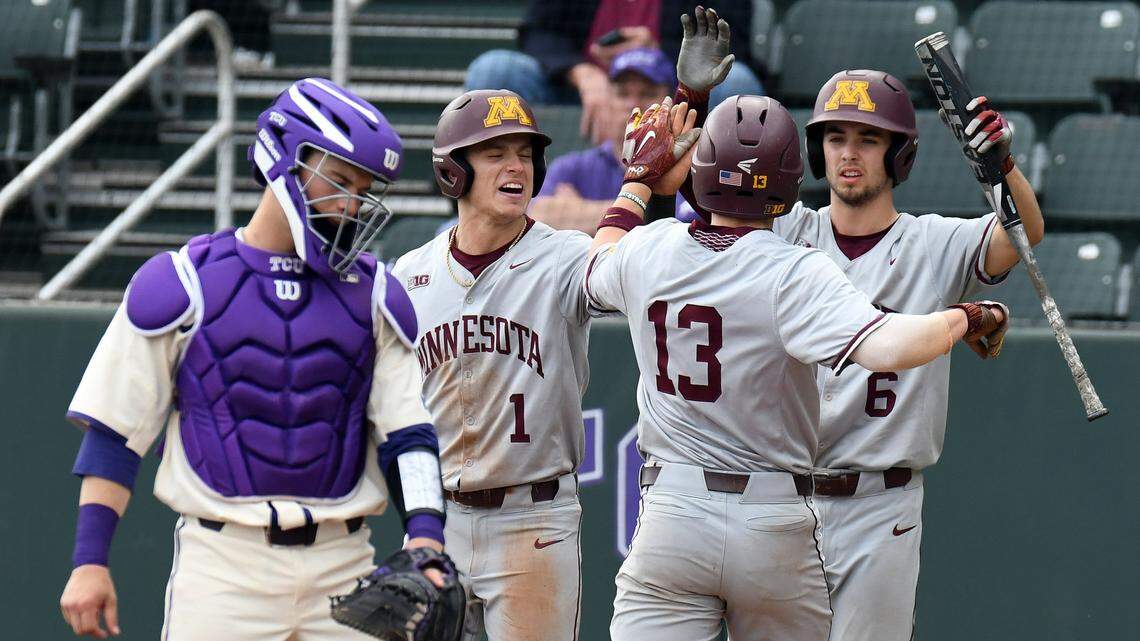 TCU catcher Colton Parrish, left reacts as Minnesota's Ben Mezzenga, left, Luke Pettersen and Terrin Varva celebrate a two-run score to take a 3-0 lead in the fifth  inning Sunday. The Golden Gophers won 8-0 to take two of three in the series.
