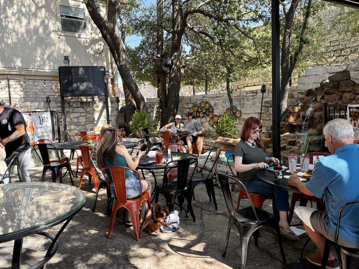 The tree-shaded back patio at Shaw’s Southwest Grille in Granbury, Texas.