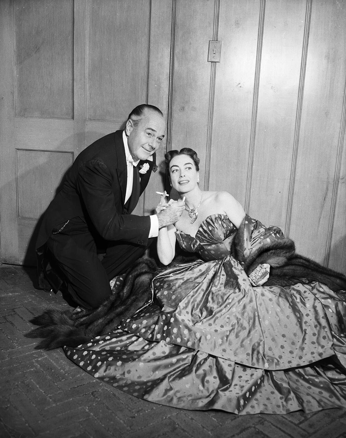 Nov. 7, 1952: Joan Crawford and William Haines, both of Hollywood, were honored guests at a cocktail party given before The Assembly ball by Mr. and Mrs. Robert F. Windfohr, and later attended the ball. Miss Crawford is the house guest of Mr. and Mrs. E. W. Schenecker.”