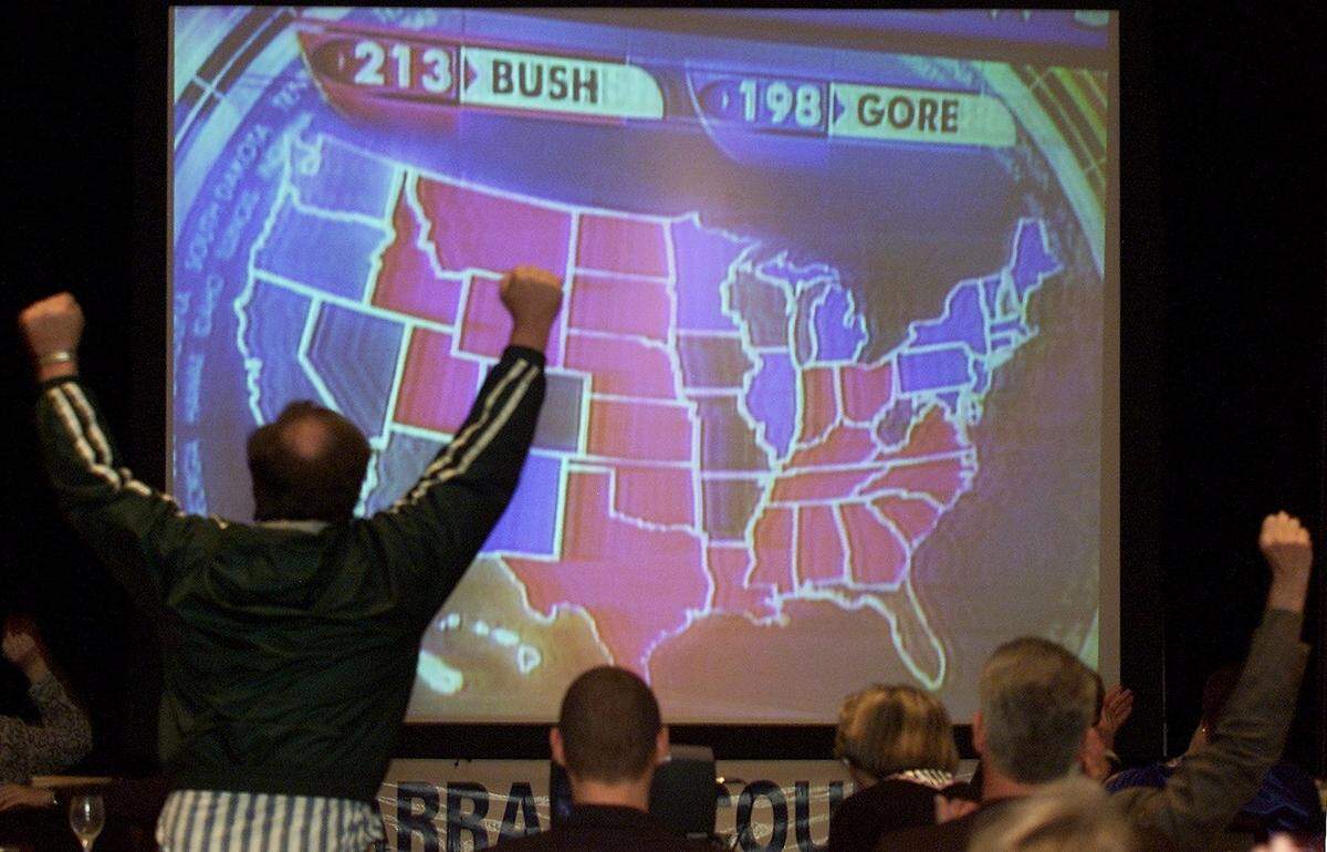 Nov. 7, 2000: David Briggs of Fort Worth stands and cheers as George W. Bush pulls ahead of Al Gore in electoral votes, during a Tarrant County GOP poll watching party at the Worthington Hotel in Fort Worth.